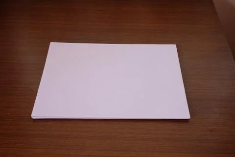 Close up of A4 white paper that placed on a table. Stock Photos