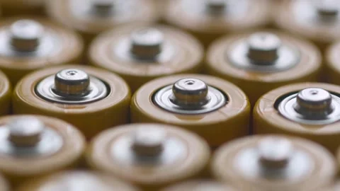Close up of AA type, Lithium-ion rechargeable and alkaline yellow batteries Stock Footage 296100352