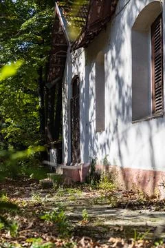 Close-up of an abandoned house in the forest. Stock Photos