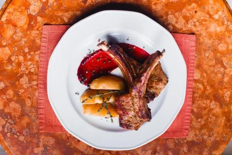 The close-up above view of the food composition. The plate full of fried ribs Stock Photos