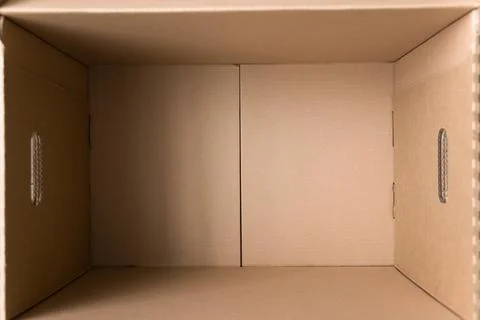 Close up above view of opened empty parcel box Stock Photos