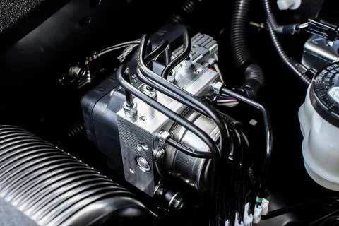 Close up of ABS module in engine bay , Anti lock brake system module Stock Photos