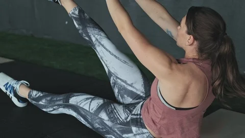 Close-up of abs workout routine at gym. Young woman doing abdominal exercise Video stock 110342071