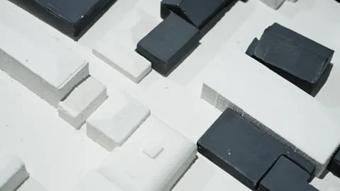 Close-up abstract arrangement of monochrome rectangular blocks forming a 스톡 동영상 327530580