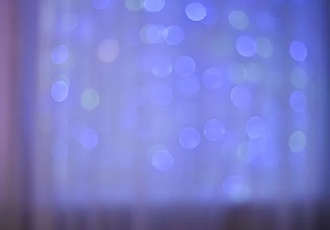 Close-up of an abstract background with bokeh lights in blue, purple, and p.. Foto stock
