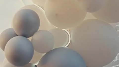 Close Up Abstract Background of White and Pastel Balloons Garland with Soft LED Stock Footage 343003750