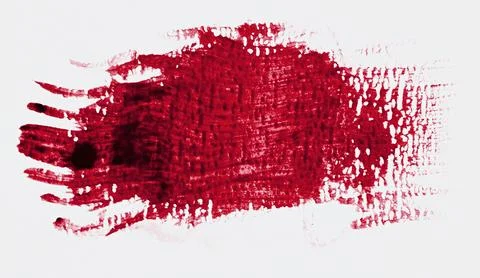 Close-up of an abstract brushstroke of thick, dark red acrylic or oil paint.. Foto stock
