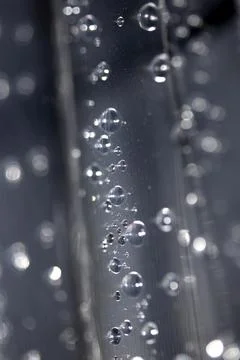 Close up of abstract floating bubbles water droplets condensation rain on a.. Stock Photos