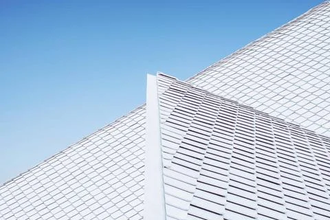 Close up of abstract geometric structure white wall and roof top against b... Stockfoto's