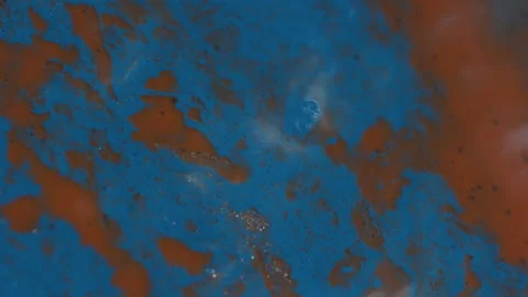 Close-up Abstract of Orange and Blue Paint Mixing Stock Footage 208761640
