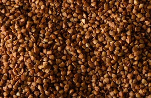 Close-up abstract pattern of raw organic buckwheat grains Stock Photos