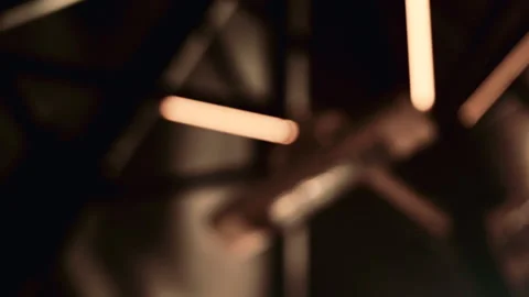 Close up abstract shot of warm linear lights completely out of focus, forming Stock Footage 322903118