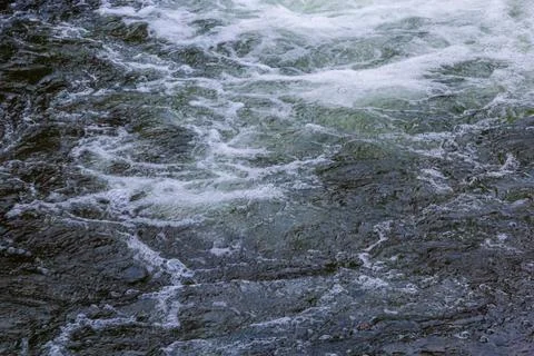 Close-up abstract texture above view of river torrent and clear fresh cold wa Stock-Fotos