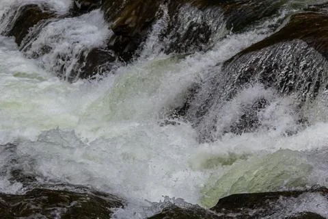 Close-up abstract texture above view of river torrent and clear fresh cold wa Photos