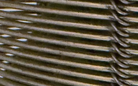Close up abstract texture pattern of intertwined metallic wires creating a .. 스톡 사진