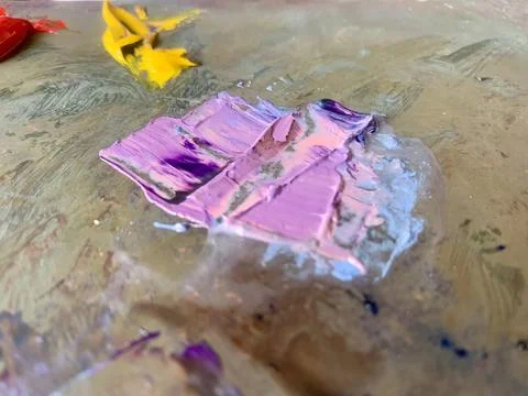 Close-up abstract texture of thick pink, purple and blue oil paint Stock Photos