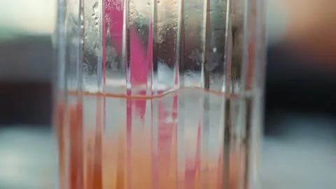 Close up abstract view of decreasing liquid in glass Stock Footage 204997995