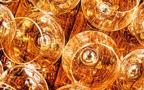 Close up abstract view of glowing warm light bulbs and wooden surface Stock Photos