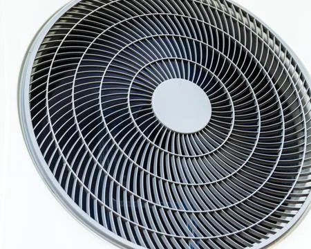 Close-up abstract view of a modern round air conditioner ventilation grille.. Stock Photos