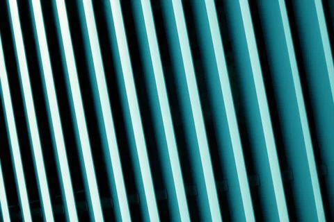 A close-up, abstract view of parallel teal and black lines angled diagonally, Stock Photos