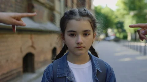 Close up of abusing little girl getting bullied outside near the school. Sad Stock Footage 201439359