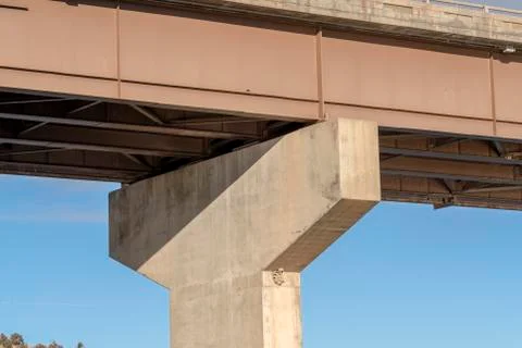 Close up of the abutment supporting the span of a beam bridge on a sunny day Foto stock