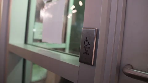 Close Up on an Accessibility Button at the Front Door of a Business shot Stock Footage 277653053