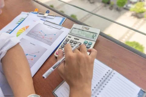 Close-up of accountant hand using calculator Stock Photos