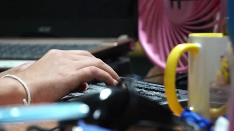 Close-up The accountant's hand is working on the computer's keyboard 库存影片 132853998
