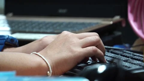 Close-up The accountant's hand is working on the computer's keyboard Stock Footage 132854110