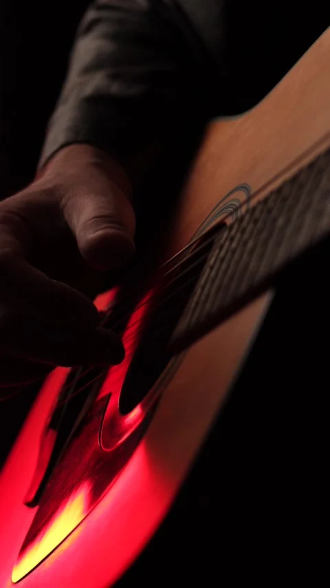 Close up of acoustic guitar strings and musician hand in warm lighting, captu Video stock 342237858
