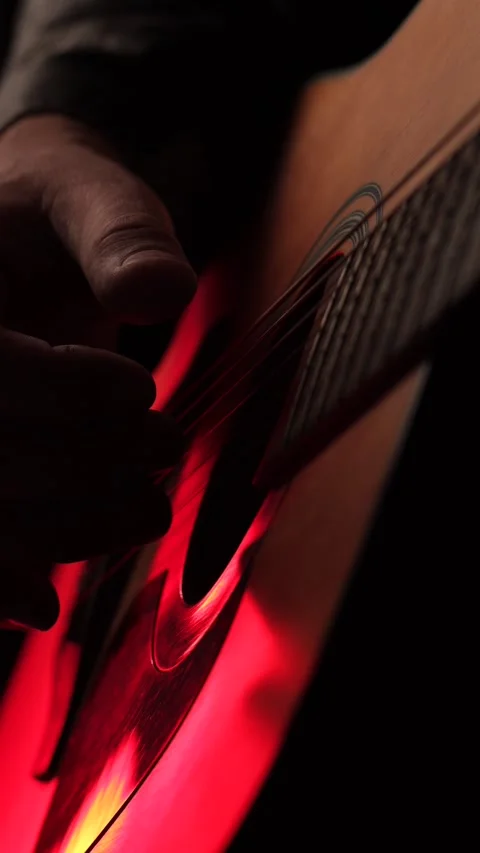 Close up of acoustic guitar strings and musician hand in warm lighting, captu Video stock 342237902