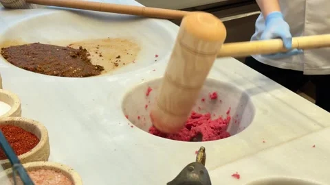 Close-up action shot of a chef using a wooden mallet to pound fresh raw meat Stock Footage 340155083