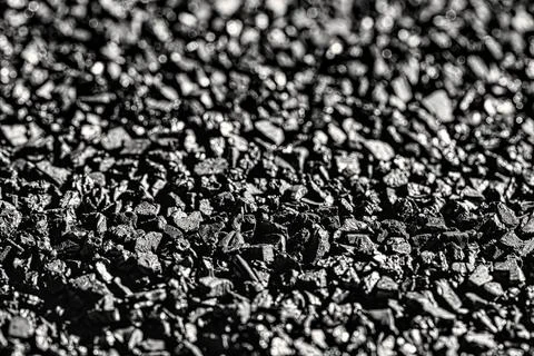 Close-up activated carbon texture. Coconut charcoal. Stock Photos