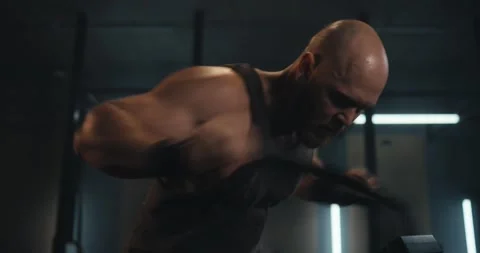 Close-up of an active male athlete making a quick movement while exercising on Stock Footage 313358506