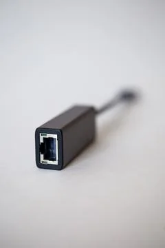 Close-up adapter for connecting ethernet - type C in a modern laptop Stock Photos