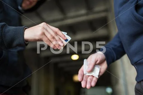 Close up of addict buying dose from drug dealer Stock Photos