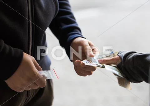 Close up of addict buying dose from drug dealer Stock Photos