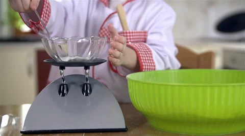 Close up of adding bicarbonate of soda to flour Video stock 34430952