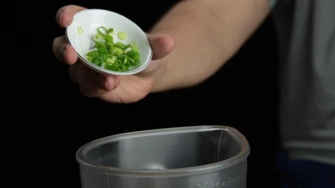 Close adding chives Stock Footage 118019835
