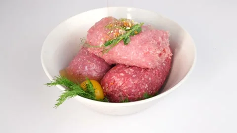 Close-up of adding herbs and spices to fresh minced meat Vidéo 146645146