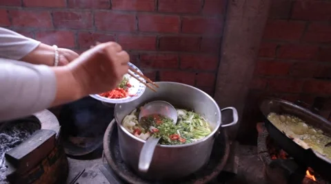 Close up adding ingredients to Vietnamese vegetable soup Stock Footage 61066762