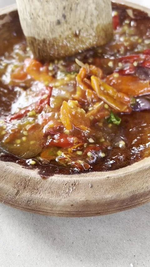 Close-up of Adding MSG Seasoning to Traditional Indonesian Sambal Ingredients Vidéo 330378547
