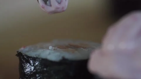 Close up adding sauce on top of sushi.close-up of adding sauce on top of sushi Stock Footage 132038146