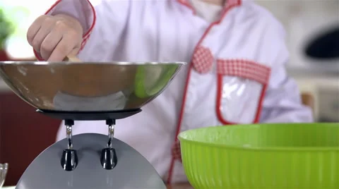 Close up of adding sugar to flour for kneading dough Video stock 34430722