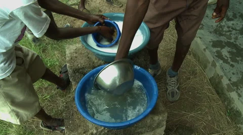 CLOSE UP: ADEISO STUDENTS WASH DISHES Stock Footage 58069779