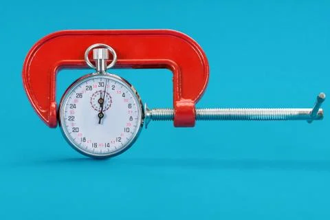 Close-up Of Adjustable Clamp And Stopwatch Over Blue Background Stock Photos