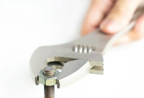Close up adjustable spanner and bolt on isolate white background. Foto stock