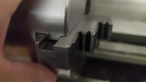 Close-up of adjusting the jaw of a lathe chuck in a machine shop 库存影片 335826652