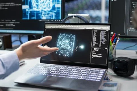 Close up of admin in data center troubleshoots issues using AI on laptop Stock Photos